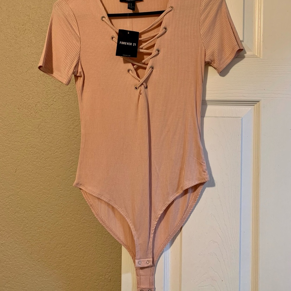 Soft pink body suit